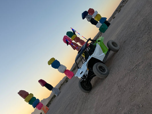 UTV with the 7 Magic Mountains in background