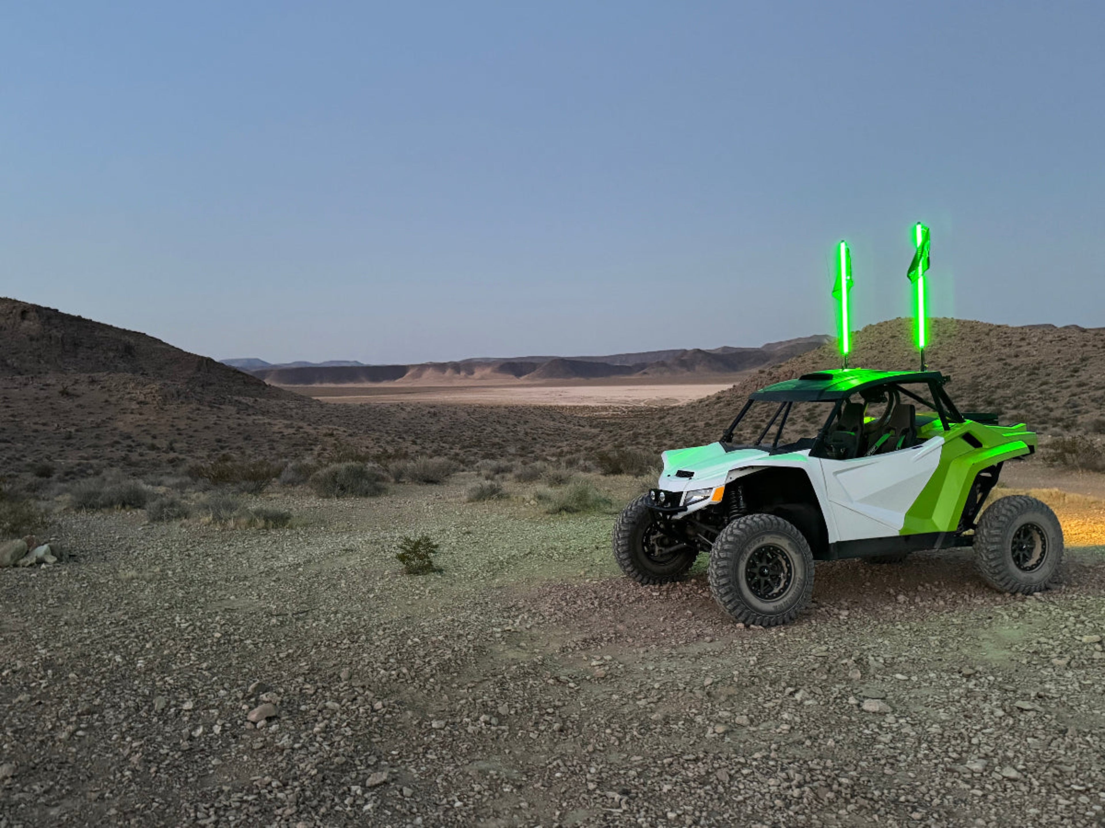 White and Green UTV with Green LED Whips in a desert scene